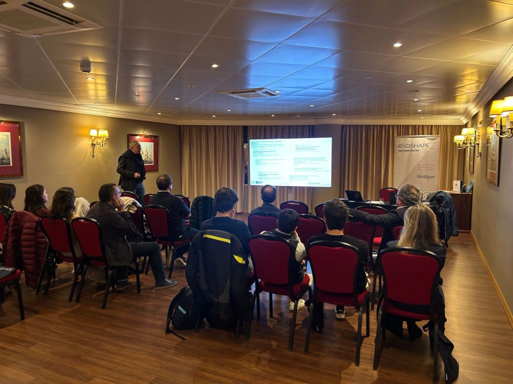 Medical education event in Lisbon featuring Pier Camillo Parodi presenting on breast reconstruction surgery with acellular matrices to an audience.